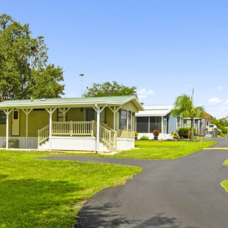 A beautiful, well-maintained home in Lake Letta RV Park, surrounded by lush greenery in the serene 55+ community of Avon Park, FL.