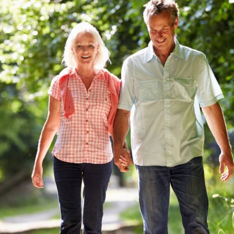 middle aged couple walking on Florida trails